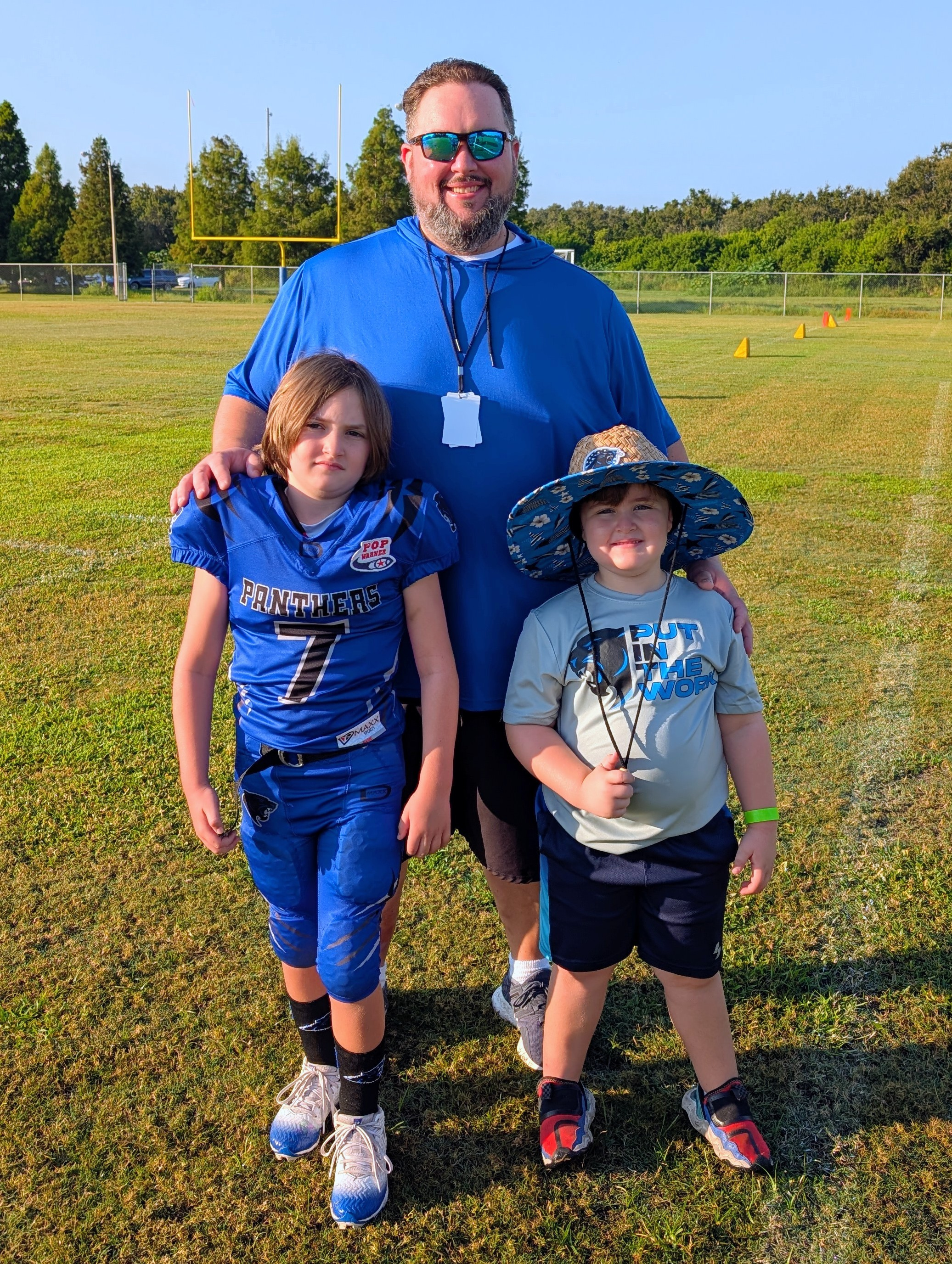 Nick coaching his children on a field